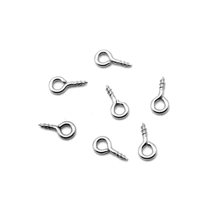 Detailed view of seven polished silver stainless steel eyelet screws for DIY jewelry making
