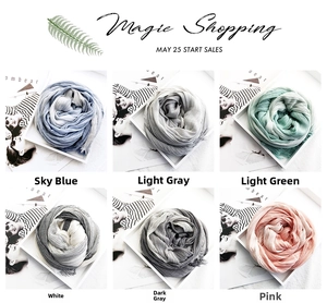 Close-up of cotton linen scarves in six soft colors with natural wrinkled textures