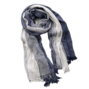 Artistic blue and white striped cotton linen scarf with fringes on a clean white background