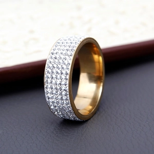 Macro view of gold titanium steel ring with rows of sparkling pavé set crystals