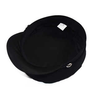 Inside view of black cotton-blend newsboy cap showing lining and size 58 label