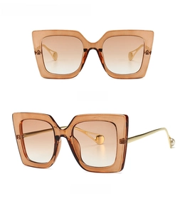 Front and side view of vintage tea square sunglasses with pearl temple details