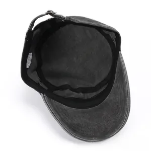 Internal detail of washed cotton army cap showing sweatband and adjustable metal buckle