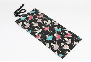 Detailed canvas roll-up pencil case with colorful ballerina prints and secure black tie strap