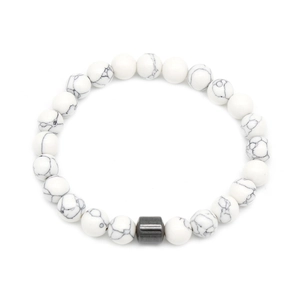 Detailed close-up of white marble stone beads and grey metallic cylinder bead on bracelet