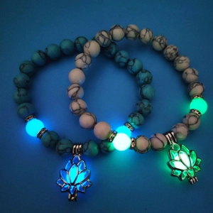 Luminous turquoise and white bead yoga bracelets with glowing lotus flower pendants