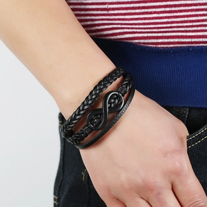 Men's black multilayer leather bracelet featuring a black infinity symbol metal clasp