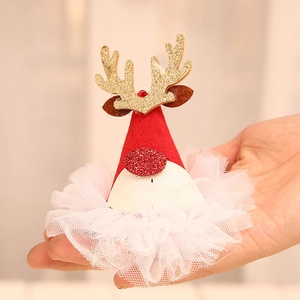 Kerst haarclip met rendier paillettenhoed van rode vliesstof en gouden geweien