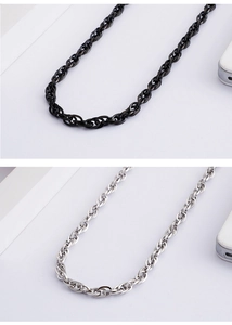 Detail view of the sleek chain necklace in black and silver polished stainless steel