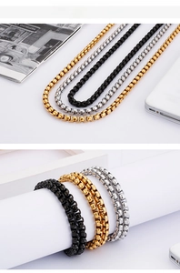 Detailed view of polished stainless steel box chains in gold, silver and black finishes