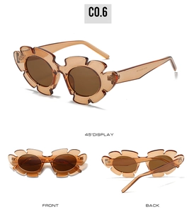 Detailed macro view of amber jelly flower sunglasses with unique petal frame and brown lens