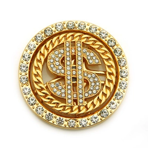 Macro shot of a golden dollar sign accessory with sparkling crystals and chain texture