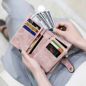 Pink matte leather passport wallet interior detail showing card slots and zipper pocket