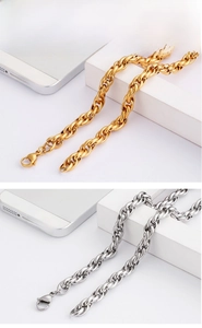 Detail of interlocking O-link chains in gold and silver finishes with lobster clasp