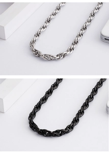 Detailed close-up showing woven chain necklaces in silver and black stainless steel finish