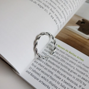Retro S925 sterling silver twisted woven open ring on book page with vintage oxidized finish