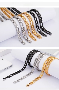 Detail of stainless steel Figaro chain in gold, silver and black with lobster clasp