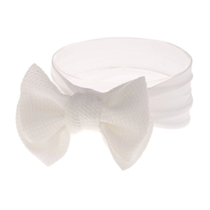 Detail of white nylon baby headband with soft waffle texture and knotted bow design