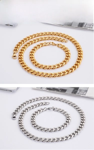 Detail view of gold and silver Cuban link chain necklaces and bracelets with lobster clasps