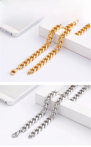 Detailed close-up of gold and silver stainless steel NK chains with lobster clasps