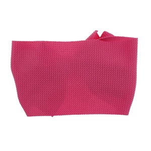 Detail view of a hot pink textured waffle fabric baby headband strip.