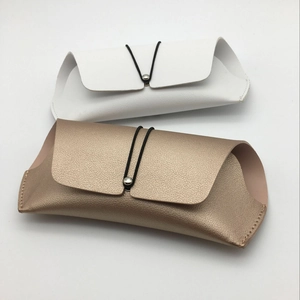 White and metallic gold PU leather eyewear pouches with metal button and elastic closure