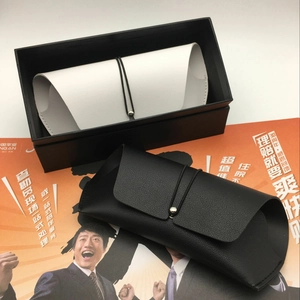 Close-up of black and white lychee pattern PU leather sunglasses pouches with elastic drawstrings