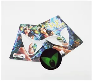 Luminous latex elf ears in packaging showing the green glow effect for Halloween cosplay