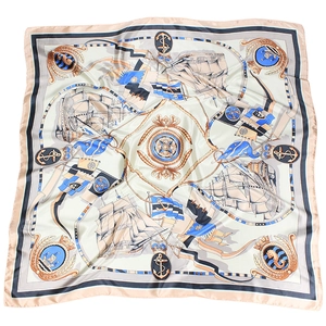 Flat lay of 90x90cm nautical satin scarf with sailing boats and anchor patterns