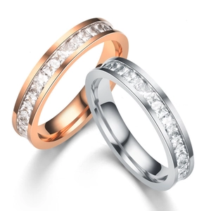Macro shot of rose gold and silver eternity rings with square-cut channel-set cubic zirconia