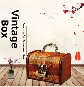 Detail showing vintage wood gift box with antique metal handle and lucky engraved padlock