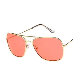 Classic gold double-bridge aviator sunglasses with peach tinted lenses in retro style