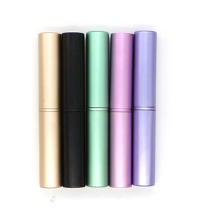 Set of 5 metallic makeup brushes and containers in gold, black, green, pink, and purple