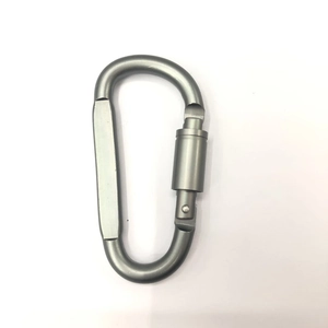 Detail of grey aluminum carabiner with manual screw locking gate mechanism
