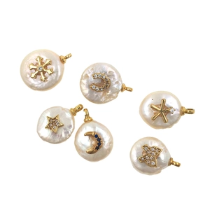 Detail of baroque pearl pendants with gold snowflake and crescent moon micro-inlay charms