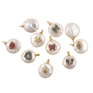 Detailed flat lay of baroque pearl button pendants with gold plating and colorful zirconia