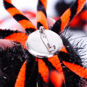 Halloween black spider brooch with orange striped furry legs and metal pin attachment