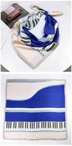 Detail of artistic piano key square scarf in royal blue and beige silk-like fabric