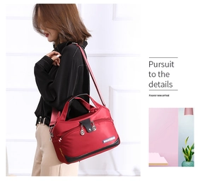 Detailed view of large capacity nylon shoulder handbag, casual crossbody bag in red.