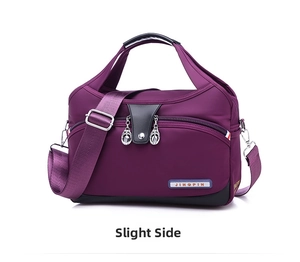 Detailed view of deep purple waterproof oxford bag with leather trim and adjustable strap
