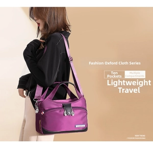 Detail view of a purple nylon crossbody bag featuring multi-pocket compartments and straps.