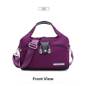 Detail showing the purple waterproof nylon bag with dual front zippers and padded handles