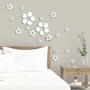 Bedroom wall decor featuring silver acrylic flower mirror stickers above the bed