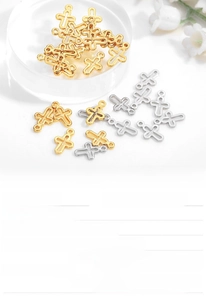 Macro detail of gold plated cross pendant made of eco-friendly copper for DIY jewelry