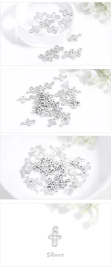 Macro shot of silver metal hollow cross charms for DIY jewelry making accessories