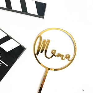 Detailed view of a gold mirror acrylic Mama cake topper with high-gloss reflective finish