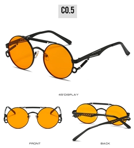 Detail view of steampunk round sunglasses with orange lenses and spring metal temples