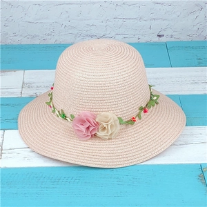 Pink straw sun hat for women with wide brim and decorative floral leaf wreath crown