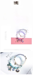 Close-up of ocean-themed bracelets with crystal beads, dolphin and shell charms