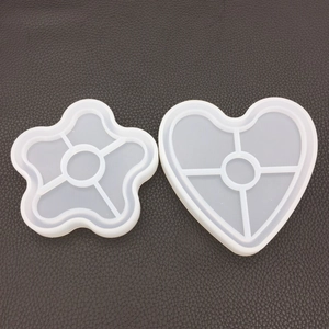 Detail of flower and heart shaped silicone molds for DIY resin casting and crafts